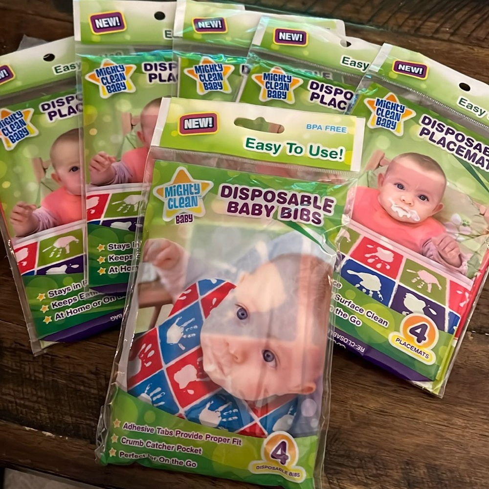 20 Disposable Placemats and 4 disposable bibs